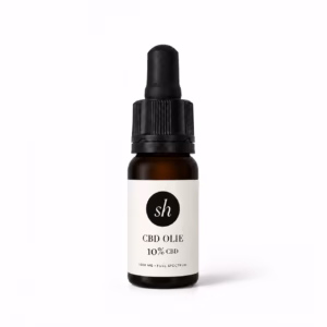Bruin glazen pipetflesje met 10% CBD olie voor dagelijks gebruik op een strakke achtergrond
